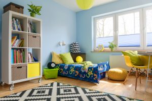 Child,Room,With,A,Bookstand,,Bed,,Chair,,Pouf,And,Big